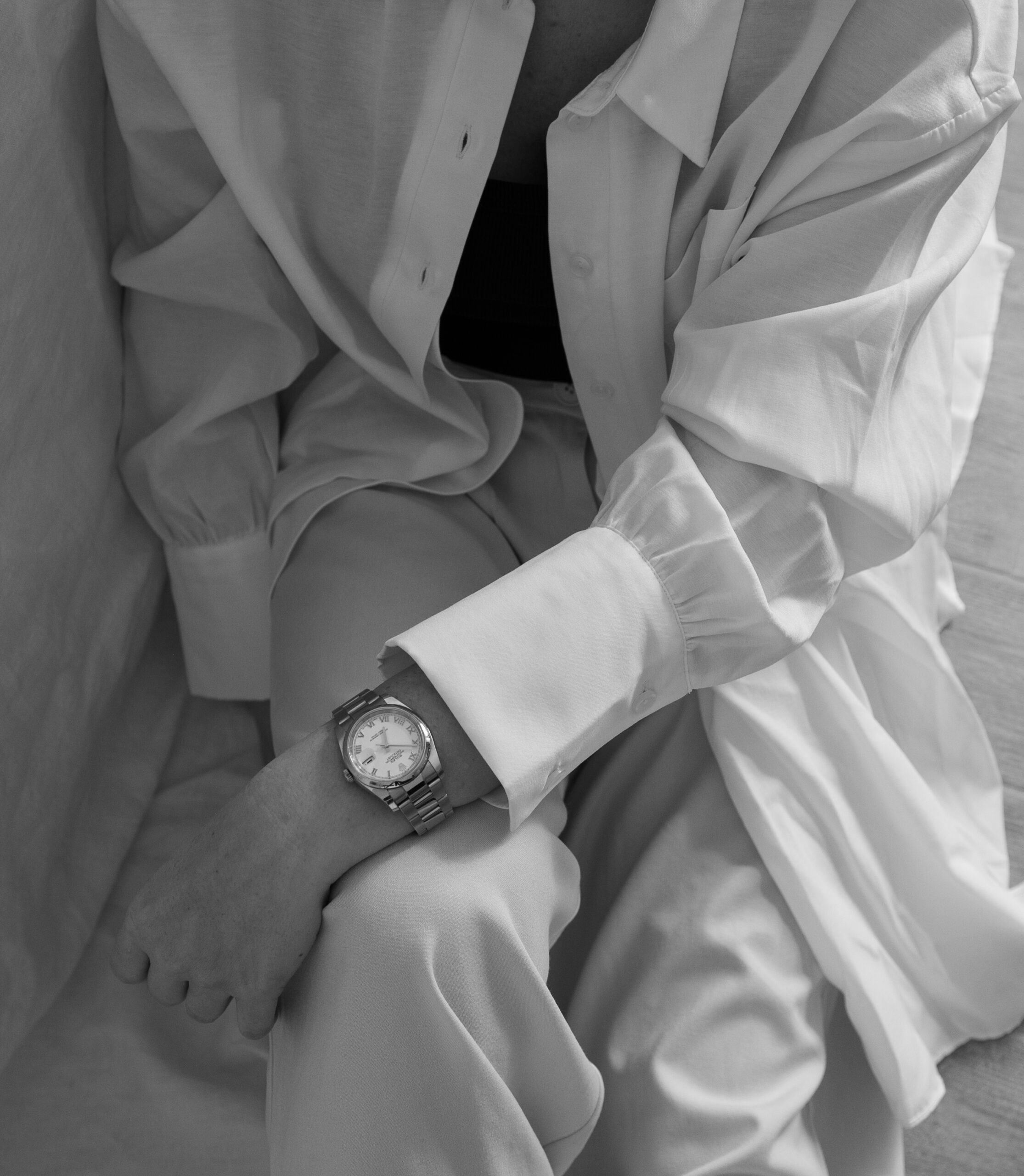 Black and White image of a woman sitting on the couch, closeup