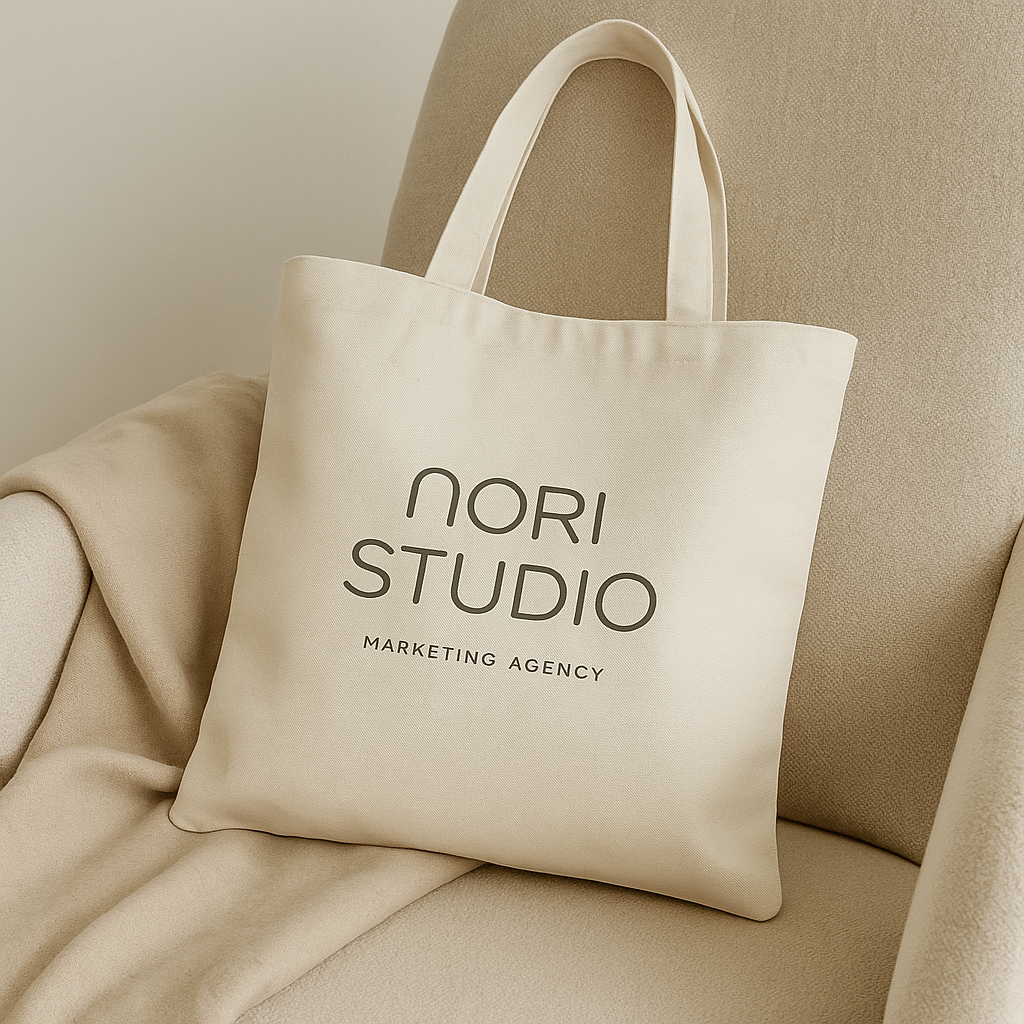 Cream color canvas bag on a couch for Nori Studio Marketing Agency